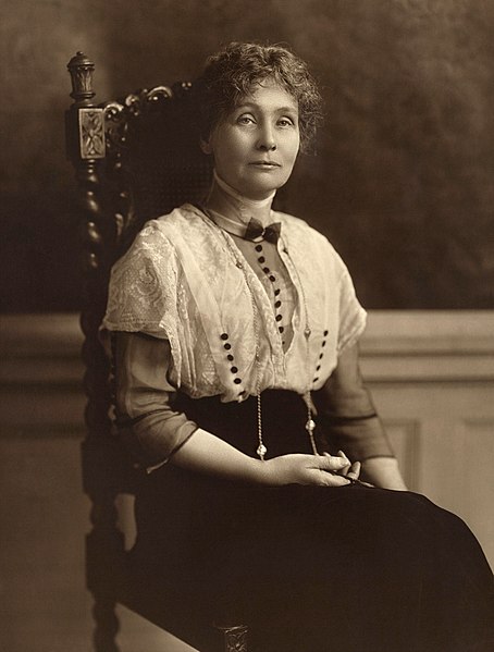 a sepia tone photo of Emmeline Pankurst sitting in a chair